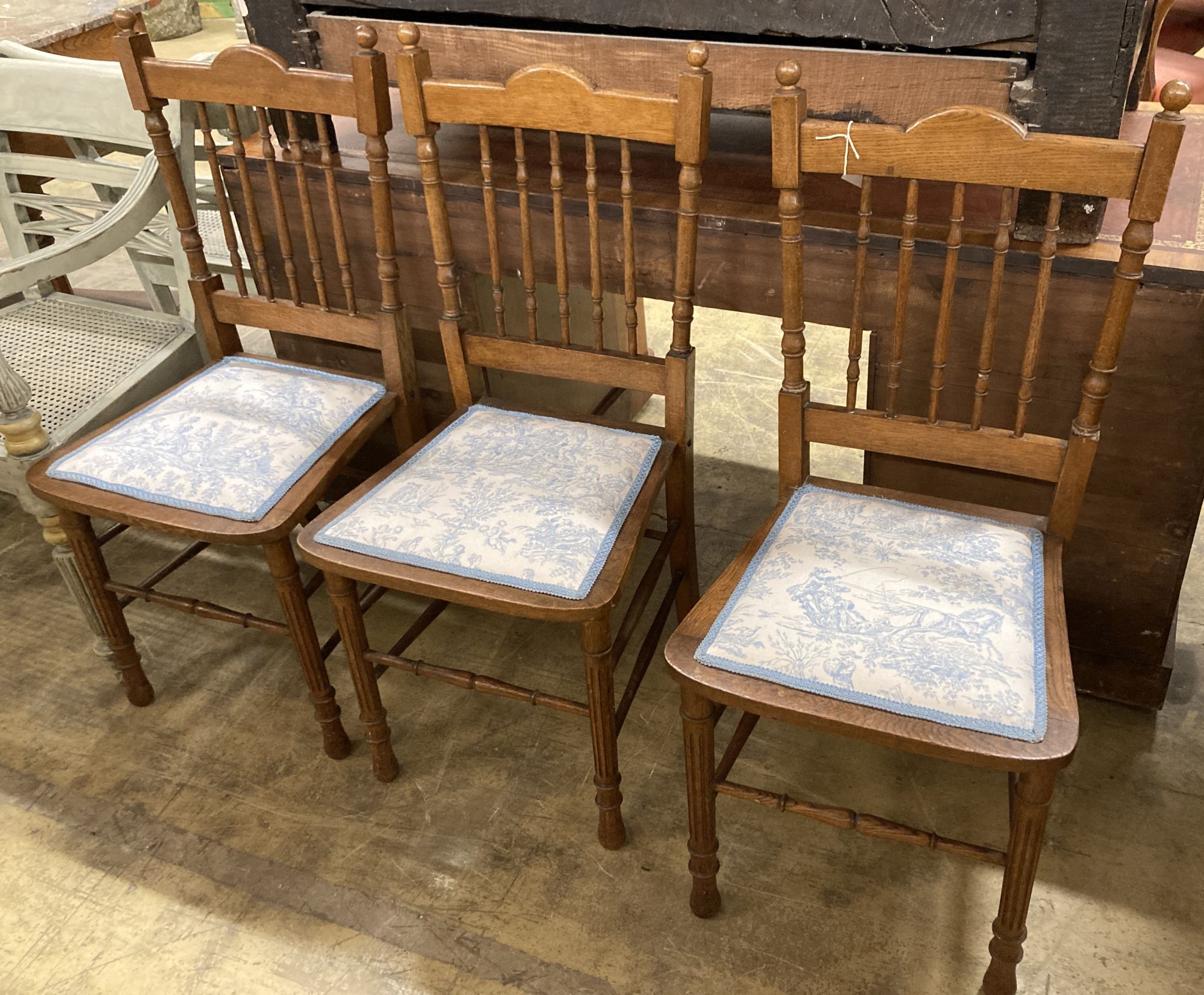 Three oak dining chairs